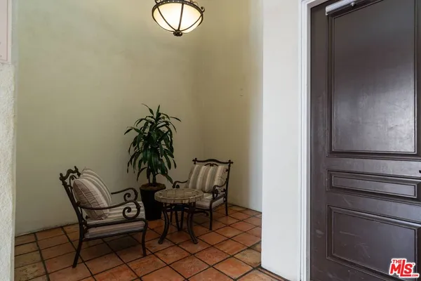 a view of a chairs and tables in the patio
