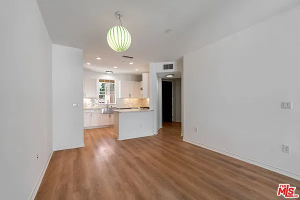 a kitchen with a sink stainless steel appliances and cabinets