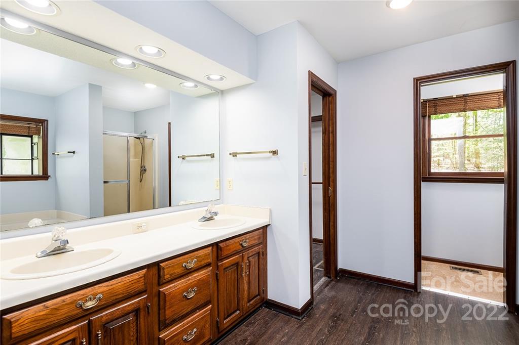 211 Westwood Drive Morganton, NC 28655 - Photo 12 of 43 a spacious bathroom with a double vanity sink and a mirror