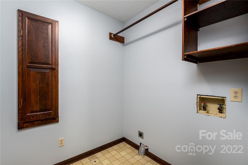 211 Westwood Drive Morganton, NC 28655 - Photo 15 of 43 a view of storage and utility room with wooden floor