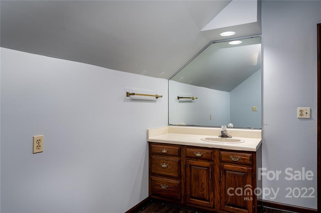211 Westwood Drive Morganton, NC 28655 - Photo 19 of 43 a bathroom with a sink and a mirror