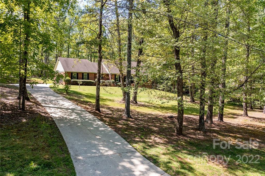 211 Westwood Drive Morganton, NC 28655 - Photo 2 of 43 a view of a yard with plants and trees