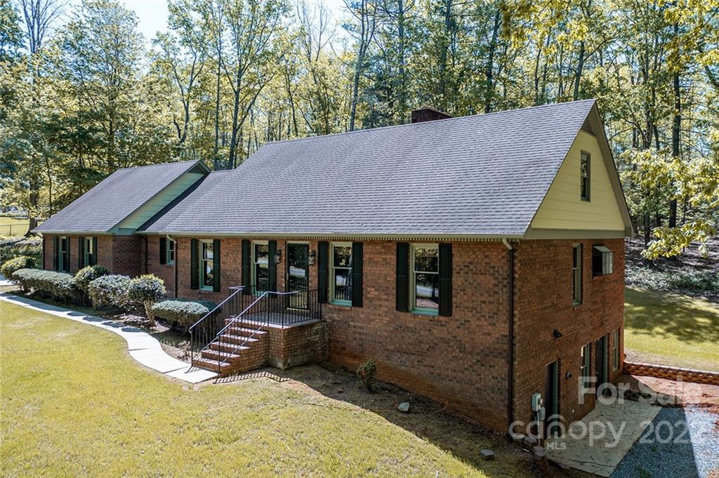 211 Westwood Drive Morganton, NC 28655 - Photo 26 of 43 a view of a house with backyard porch and sitting area