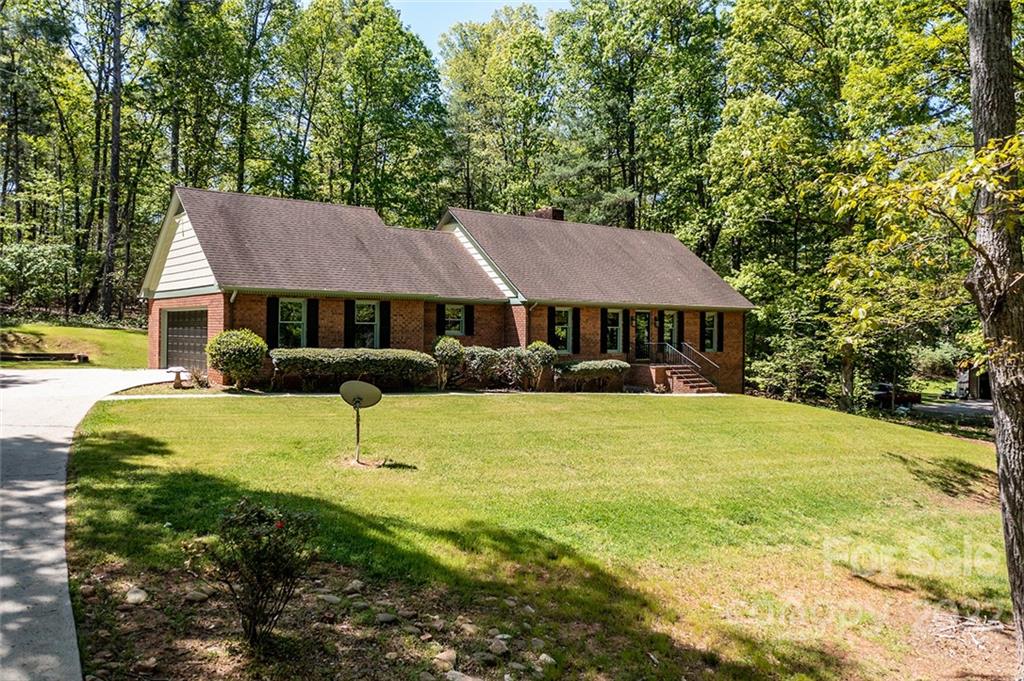 211 Westwood Drive Morganton, NC 28655 - Photo 36 of 43 a backyard of a house with yard and outdoor seating