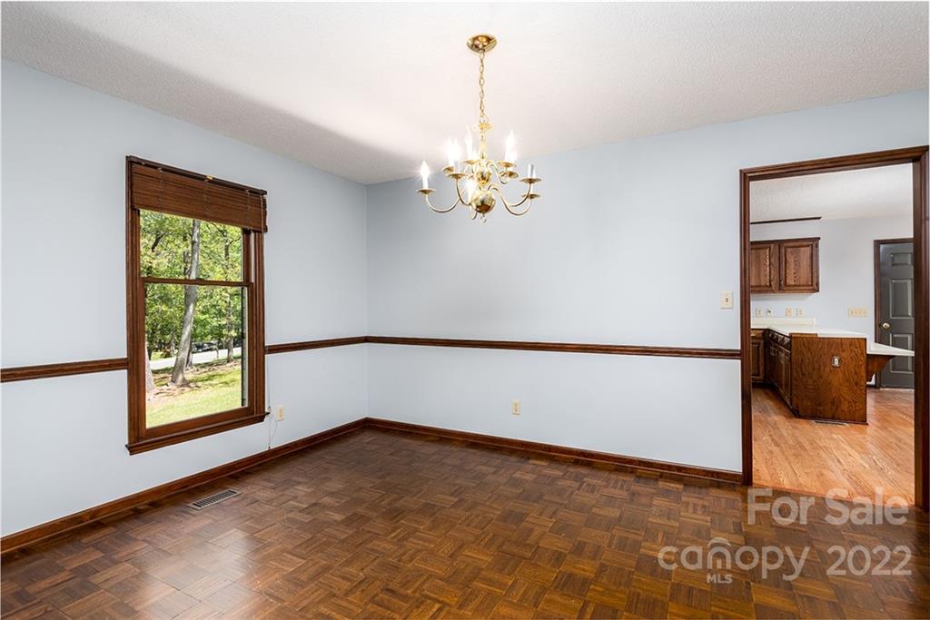211 Westwood Drive Morganton, NC 28655 - Photo 8 of 43 wooden floor in an empty room with a window