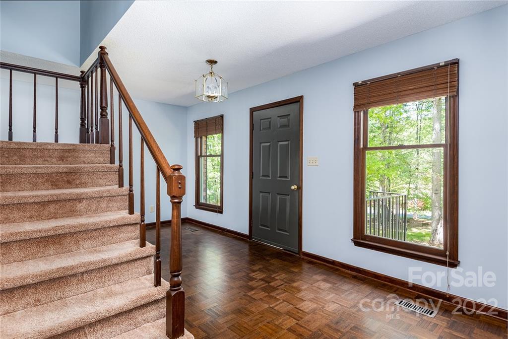 211 Westwood Drive Morganton, NC 28655 - Photo 10 of 43 a view of staircase with wooden floor and a window