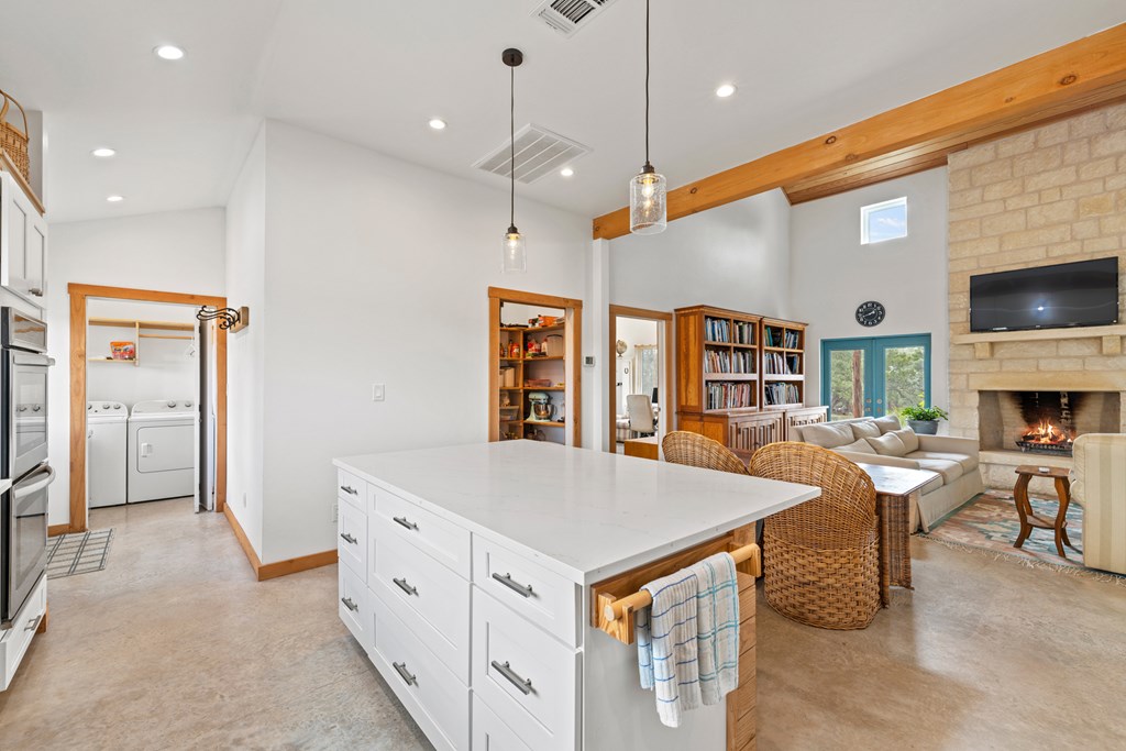 456 Colt Valley Road Fredericksburg, TX 78624 - Photo 11 of 46 a open kitchen with stainless steel appliances granite countertop a stove and a refrigerator