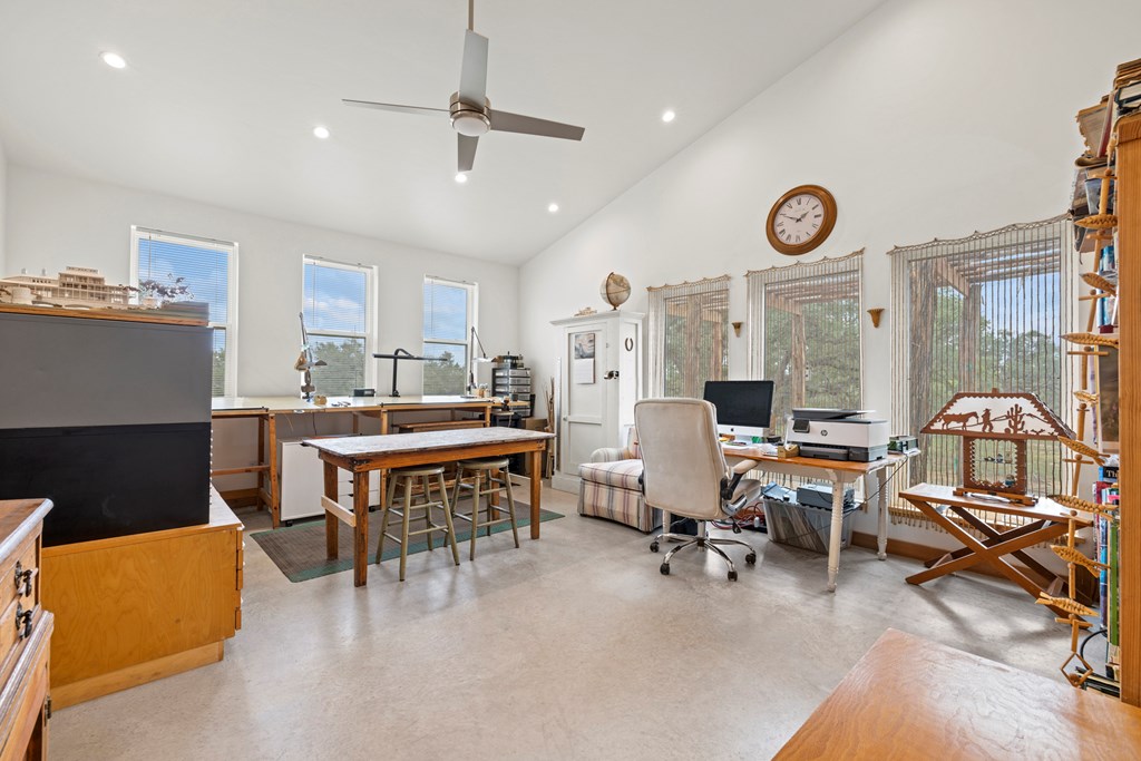 456 Colt Valley Road Fredericksburg, TX 78624 - Photo 17 of 46 a living room with furniture a rug and white walls
