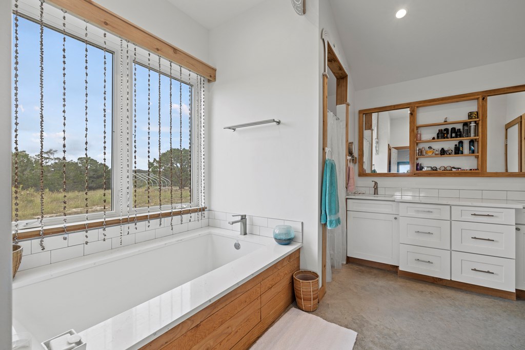 456 Colt Valley Road Fredericksburg, TX 78624 - Photo 20 of 46 a bathroom with a bathtub and a sink