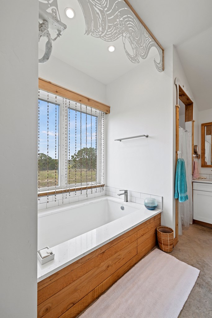 456 Colt Valley Road Fredericksburg, TX 78624 - Photo 21 of 46 a bathroom with a bathtub and a sink