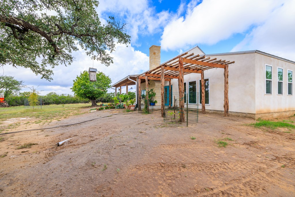 456 Colt Valley Road Fredericksburg, TX 78624 - Photo 5 of 46 front view of a house with a yard