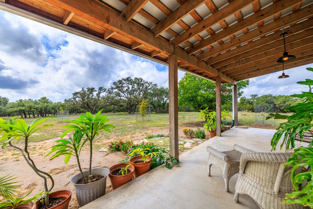 456 Colt Valley Road Fredericksburg, TX 78624 - Photo 7 of 46 a view of swimming pool with outdoor seating and plants