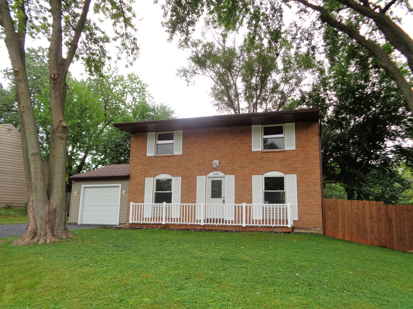 226 Seabury Road Bolingbrook, IL 60440 - Photo 1 of 24 a front view of a house with a garden