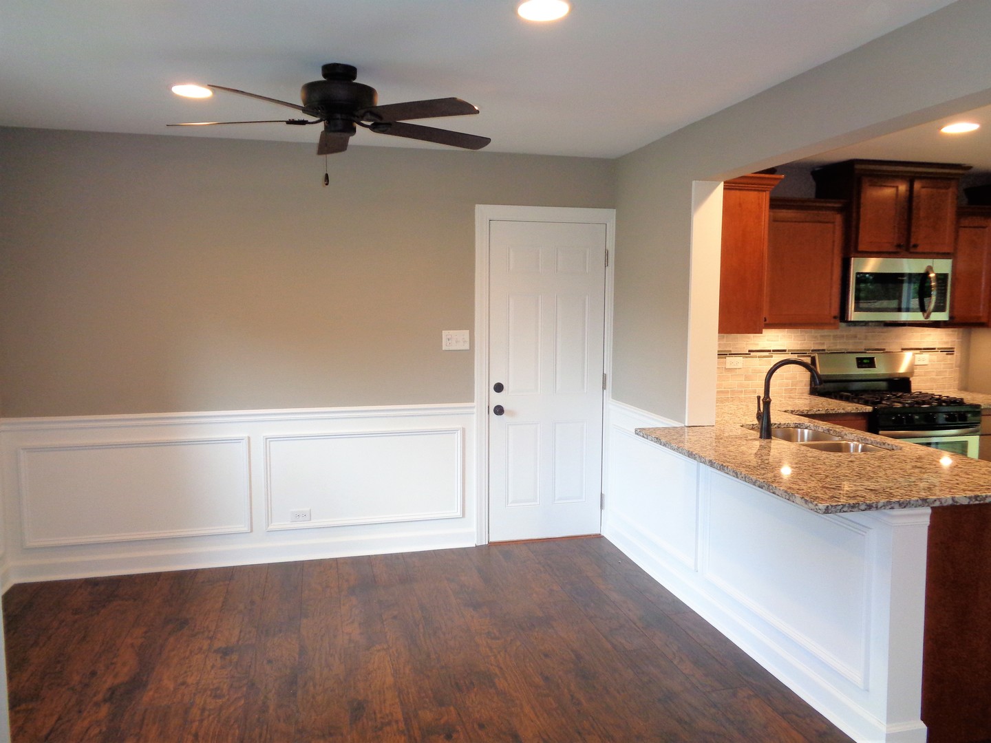 226 Seabury Road Bolingbrook, IL 60440 - Photo 2 of 24 a kitchen with granite countertop a sink stainless steel appliances and cabinets