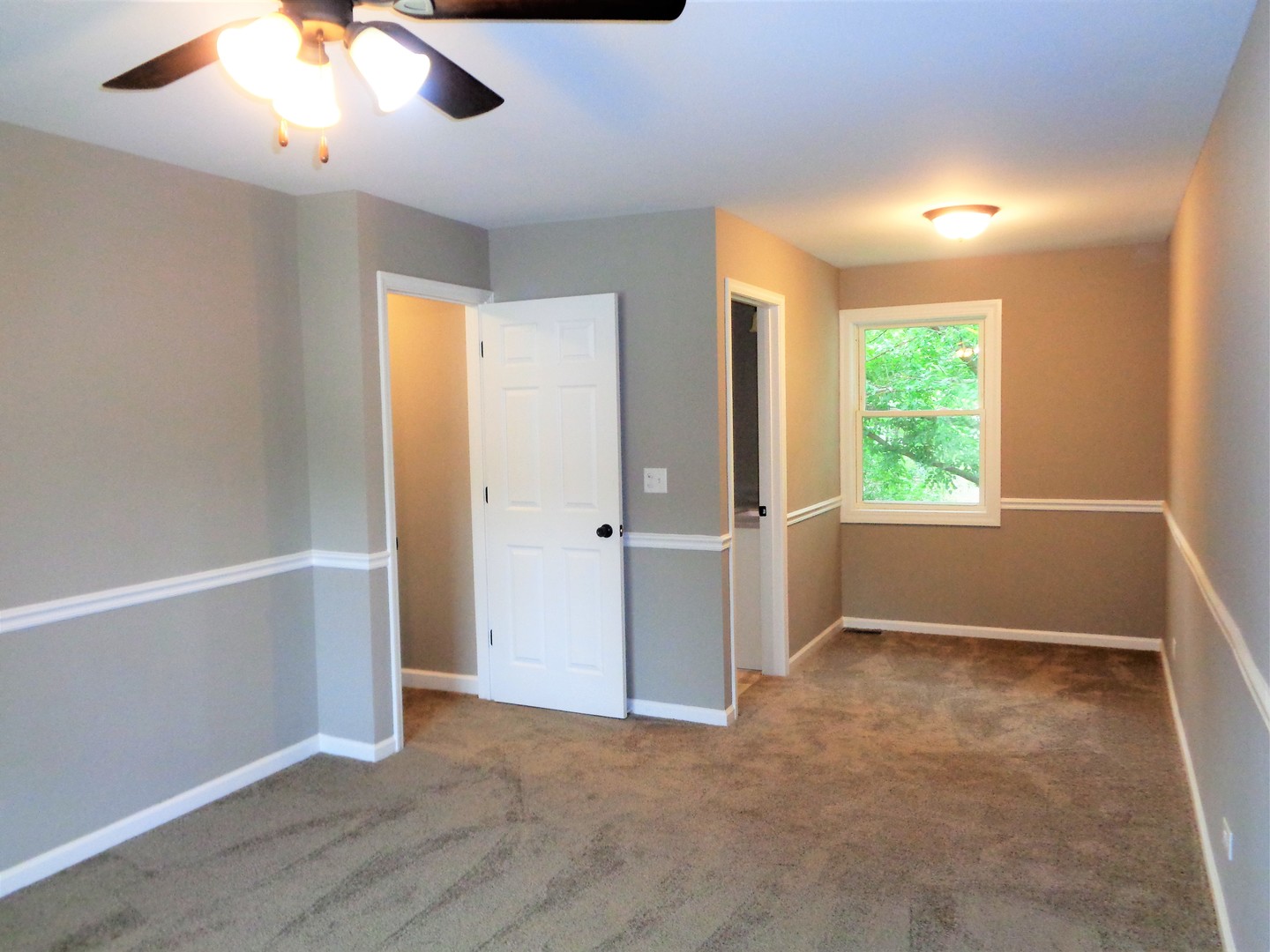 226 Seabury Road Bolingbrook, IL 60440 - Photo 12 of 24 an empty room with windows and cabinet