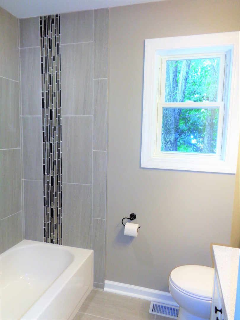 226 Seabury Road Bolingbrook, IL 60440 - Photo 13 of 24 a bathroom with a toilet and a shower