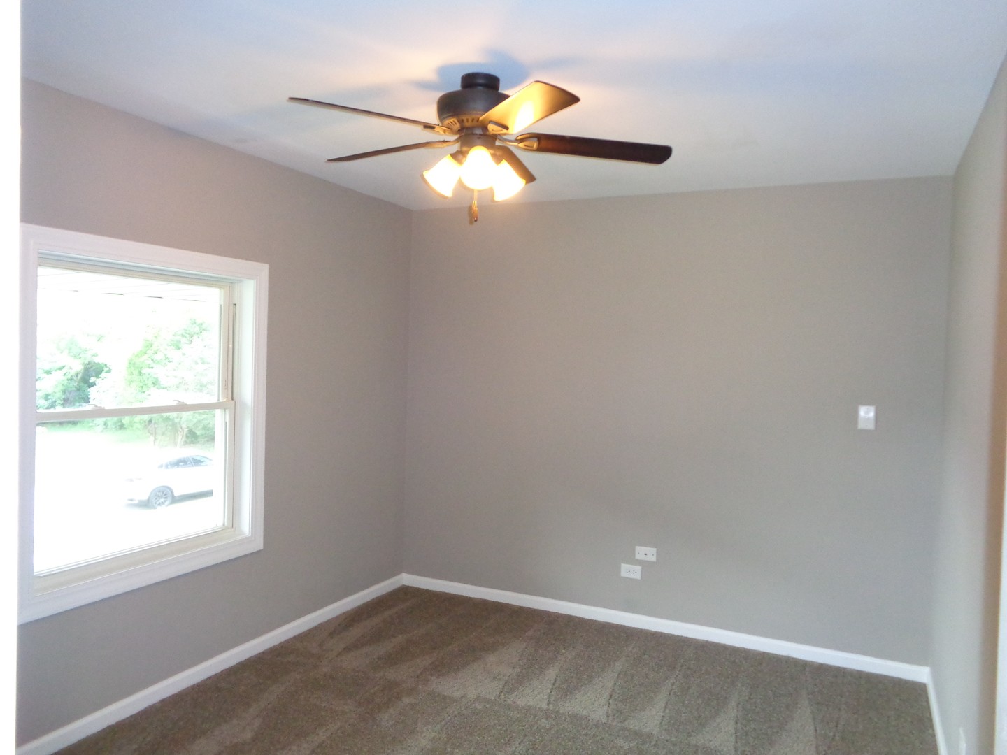 226 Seabury Road Bolingbrook, IL 60440 - Photo 15 of 24 an empty room with windows and fan