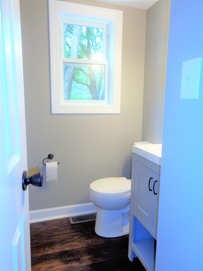 226 Seabury Road Bolingbrook, IL 60440 - Photo 5 of 24 a bathroom with a toilet and a sink