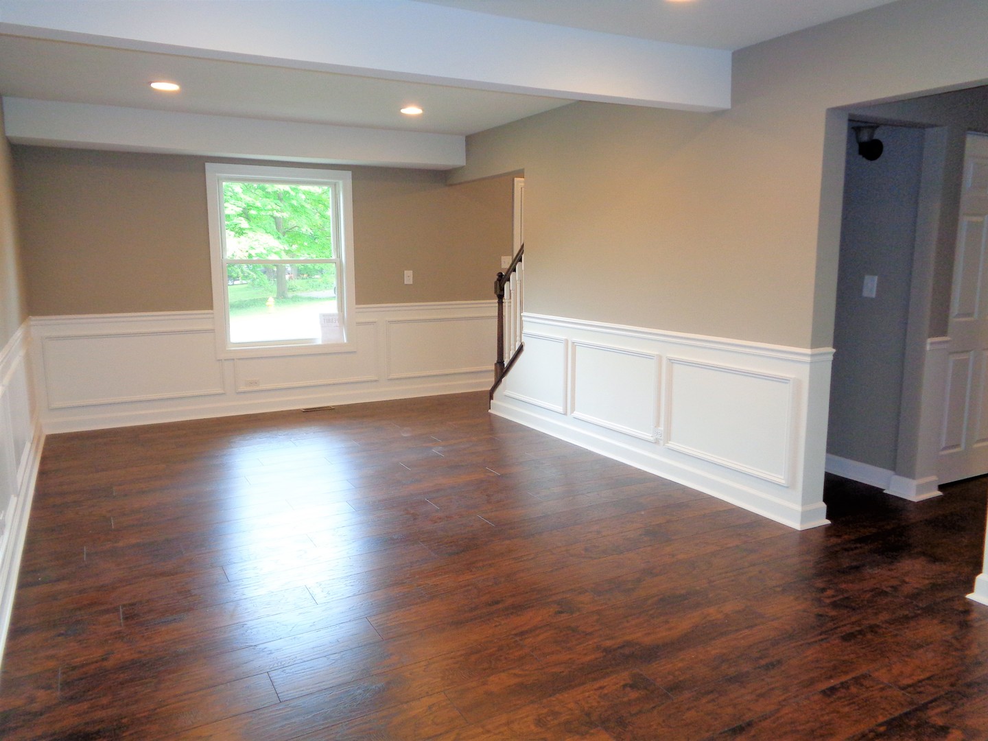 226 Seabury Road Bolingbrook, IL 60440 - Photo 6 of 24 an empty room with wooden floor and windows
