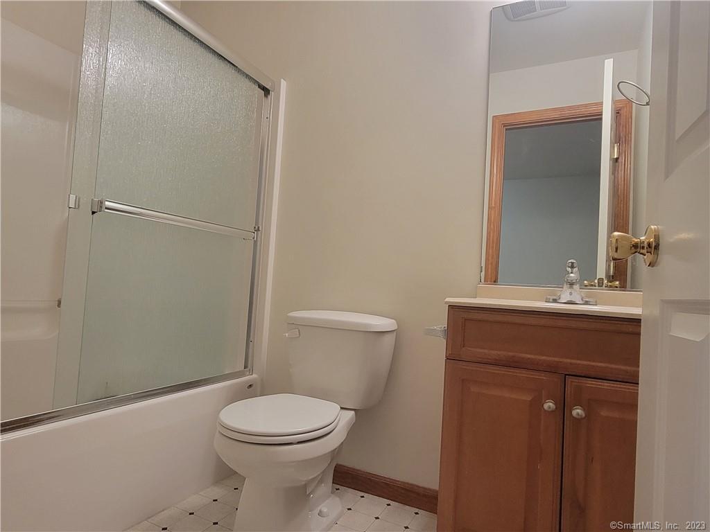 21 Bellevue Avenue, Unit B Vernon, CT 06066 - Photo 14 of 14 a bathroom with a toilet a sink and shower