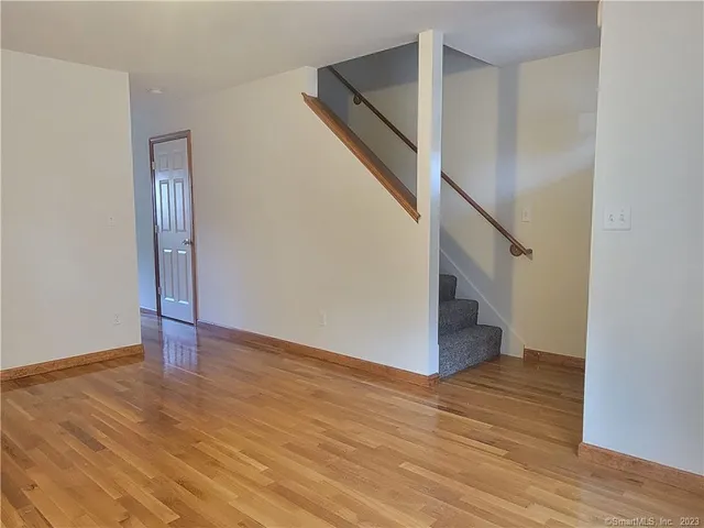 a view of an entryway with wooden floor
