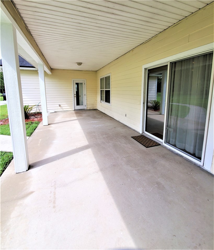 54414 Armstrong Road Callahan, FL 32011 - Photo 17 of 25 a view of a porch