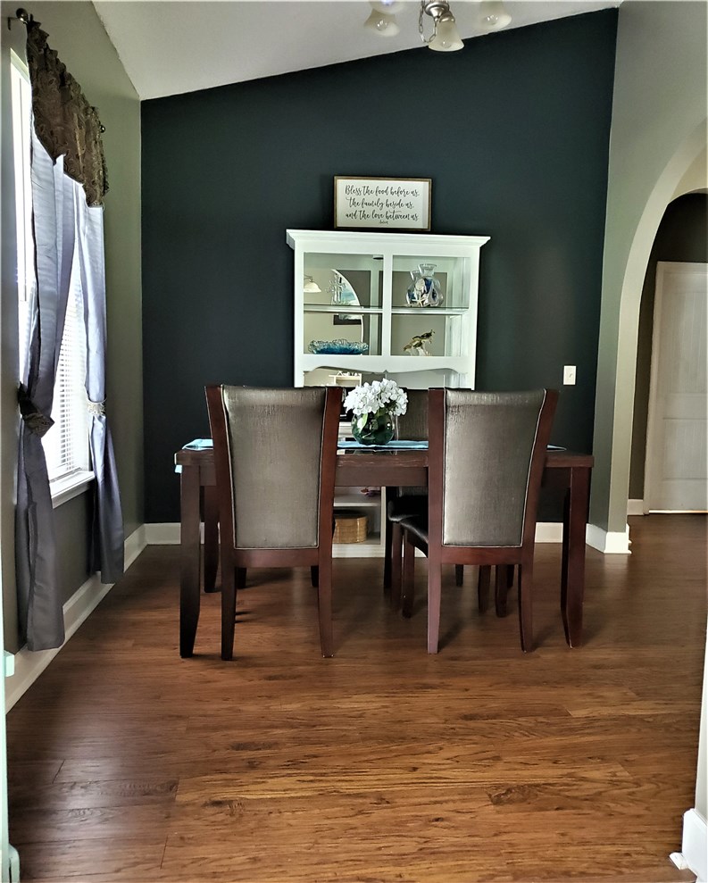 54414 Armstrong Road Callahan, FL 32011 - Photo 25 of 25 a view of a dining room with furniture window and wooden floor