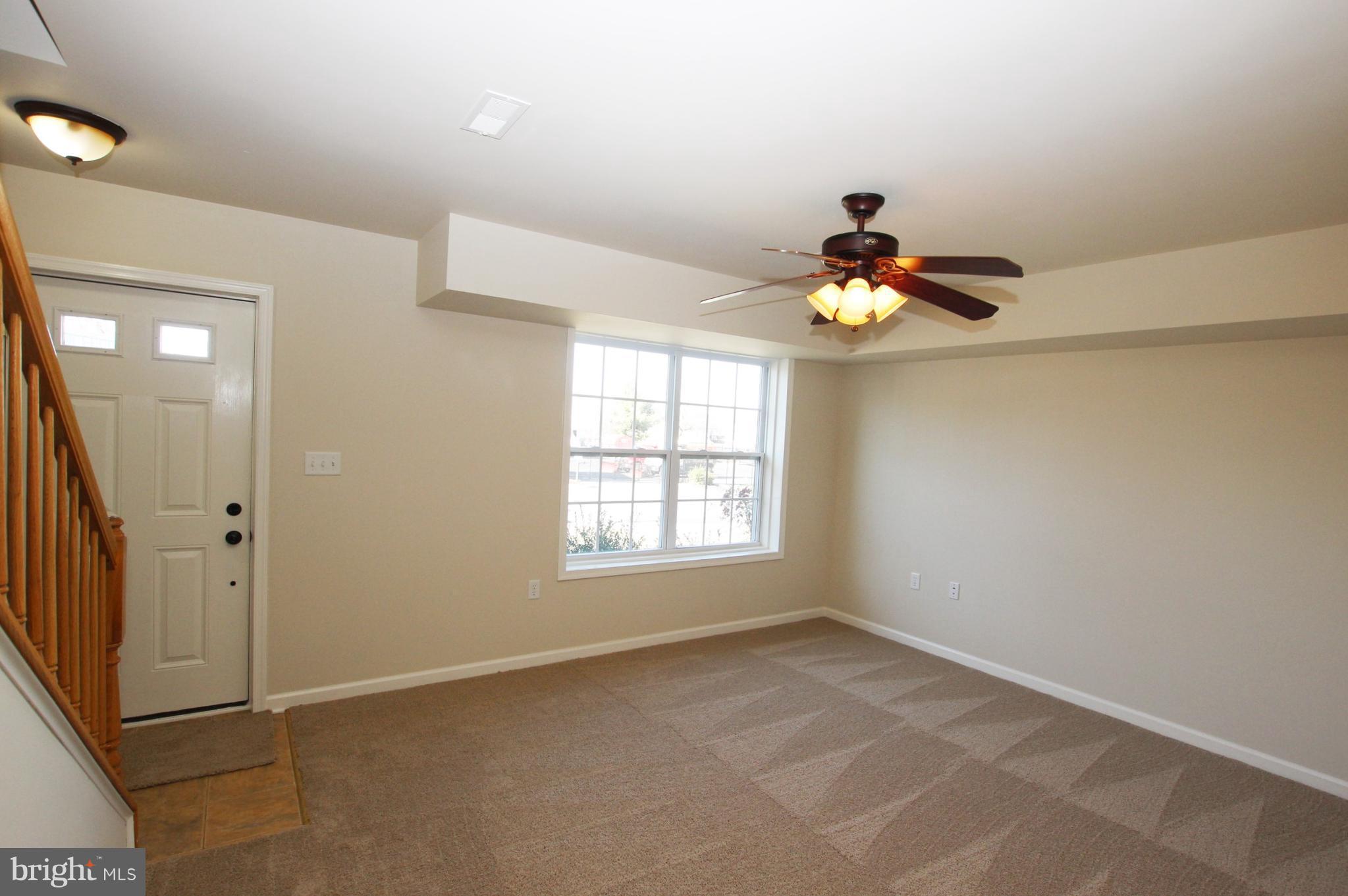 312 East 5th Avenue Ranson, WV 25438 - Photo 2 of 18 a view of an empty room and window