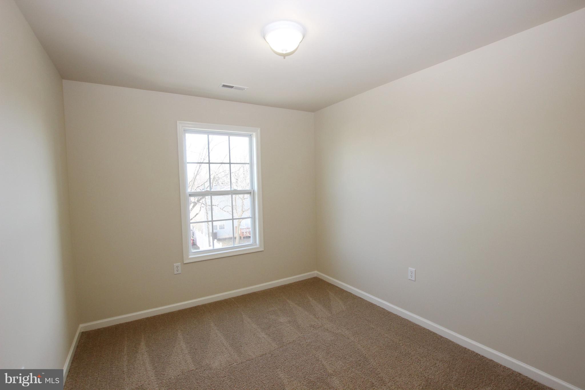 312 East 5th Avenue Ranson, WV 25438 - Photo 15 of 18 an empty room with a window