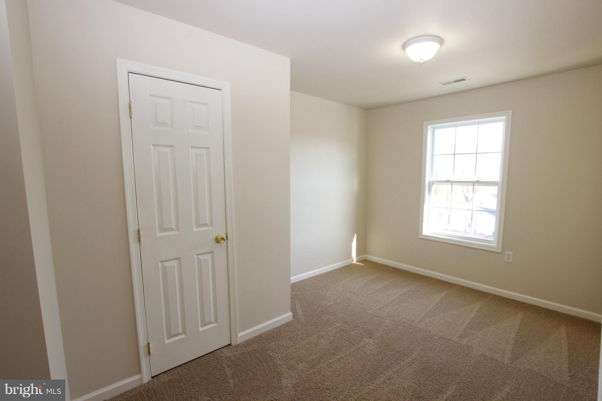 312 East 5th Avenue Ranson, WV 25438 - Photo 16 of 18 an empty room with a window