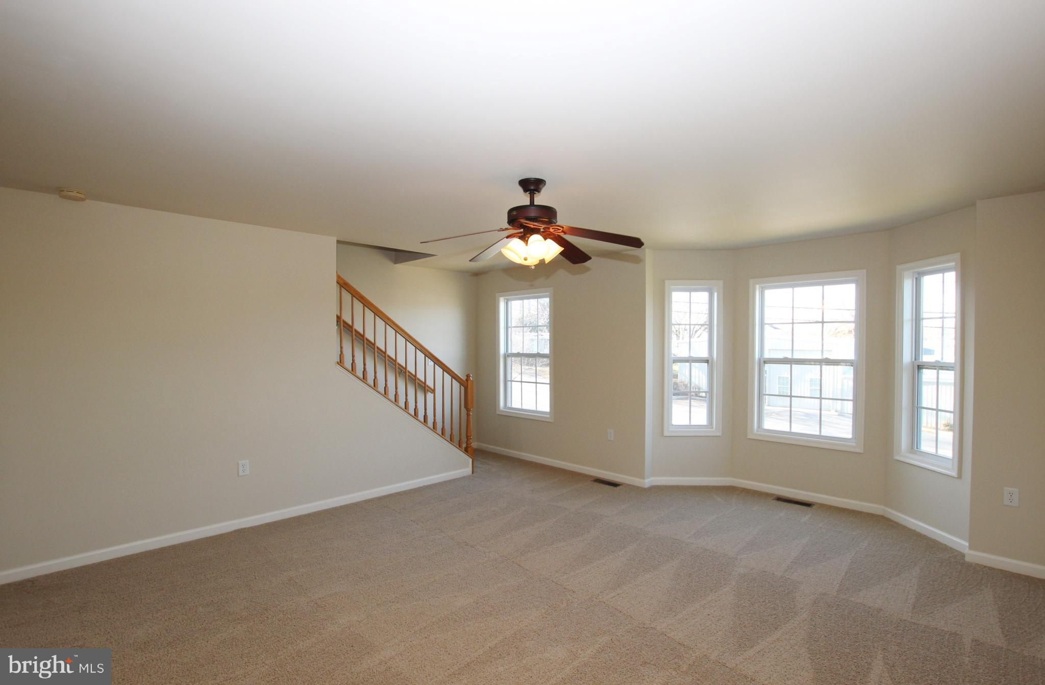 312 East 5th Avenue Ranson, WV 25438 - Photo 4 of 18 a view of an empty room with a window