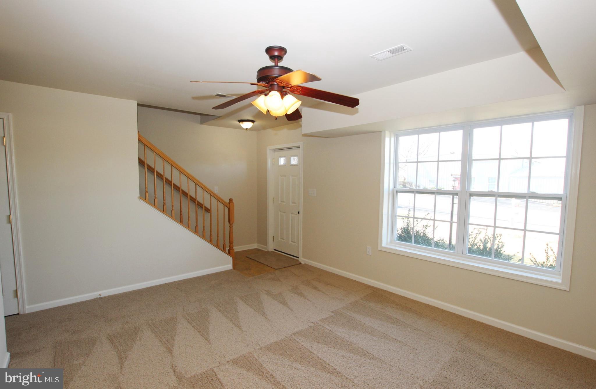 312 East 5th Avenue Ranson, WV 25438 - Photo 5 of 18 a view of an empty room with a window
