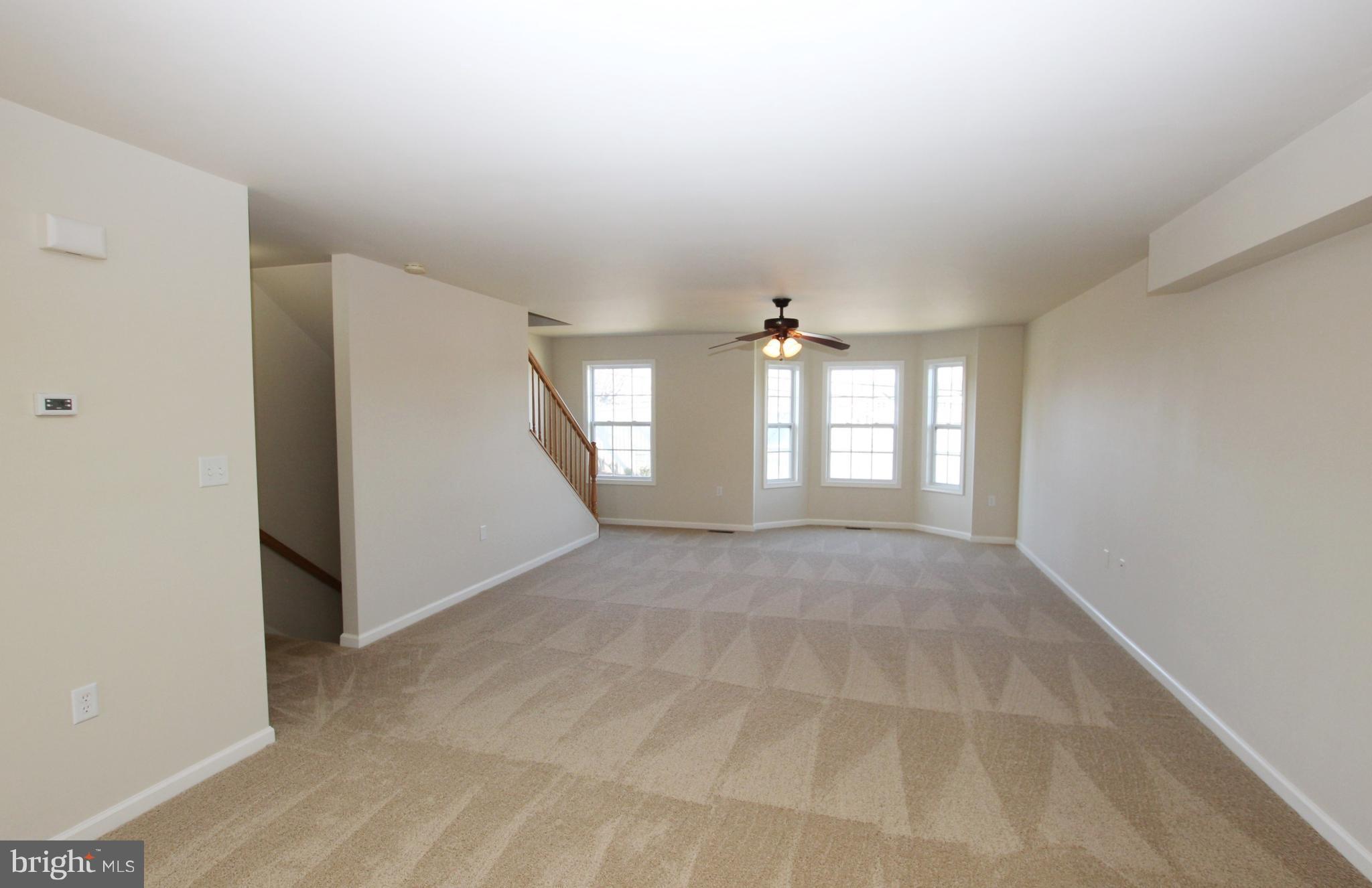 312 East 5th Avenue Ranson, WV 25438 - Photo 6 of 18 a view of an empty room with a window