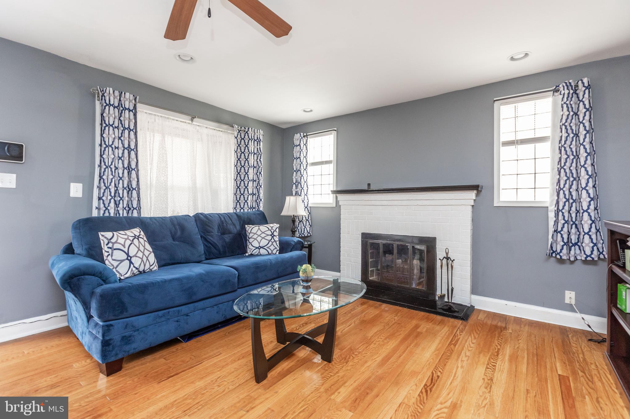 1911 Ramblewood Road Baltimore, MD 21239 - Photo 4 of 29 Living room features an electric fireplace.