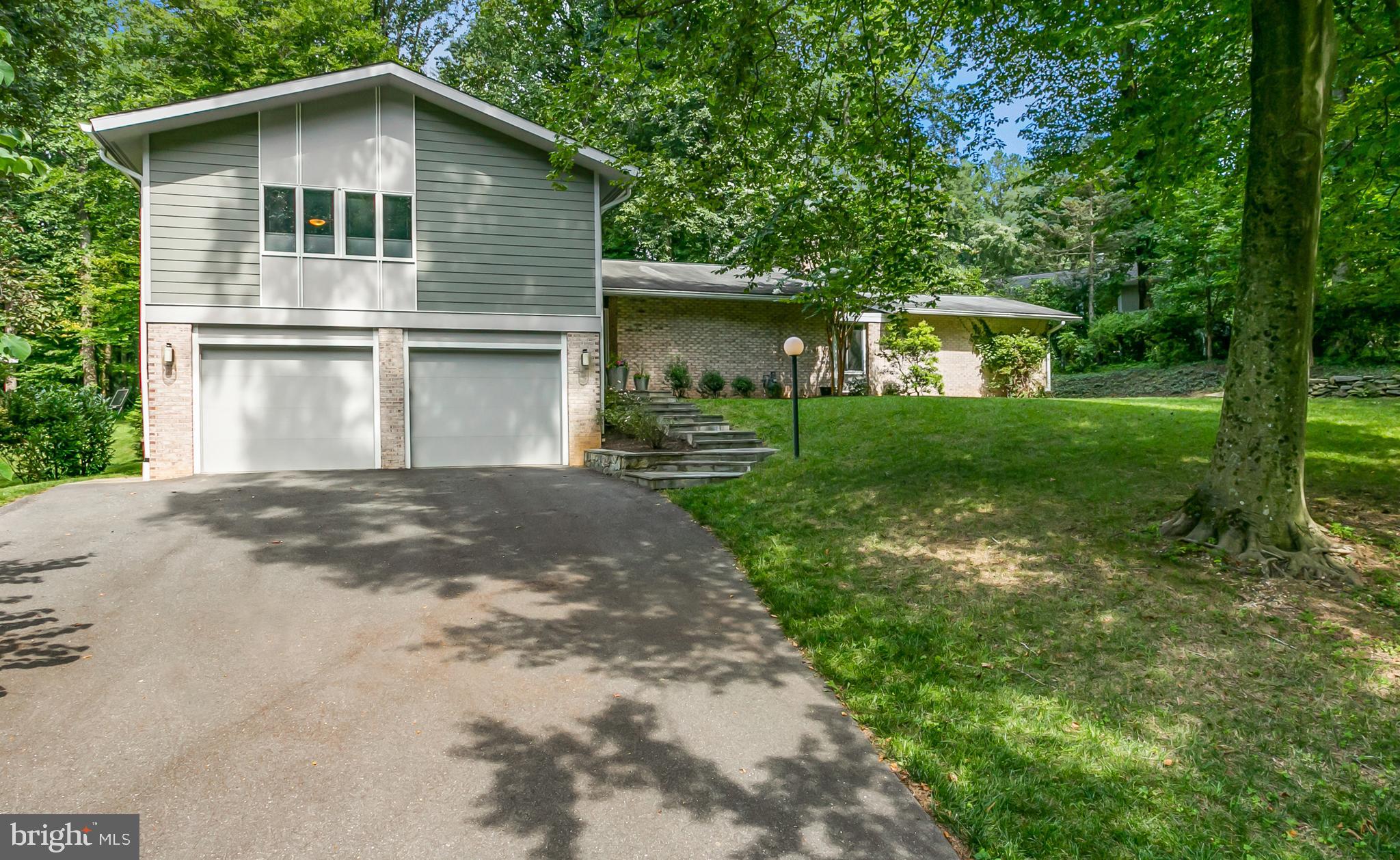 8117 Hamilton Spring Road Bethesda, MD 20817 - Photo 1 of 1 a front view of a house with yard