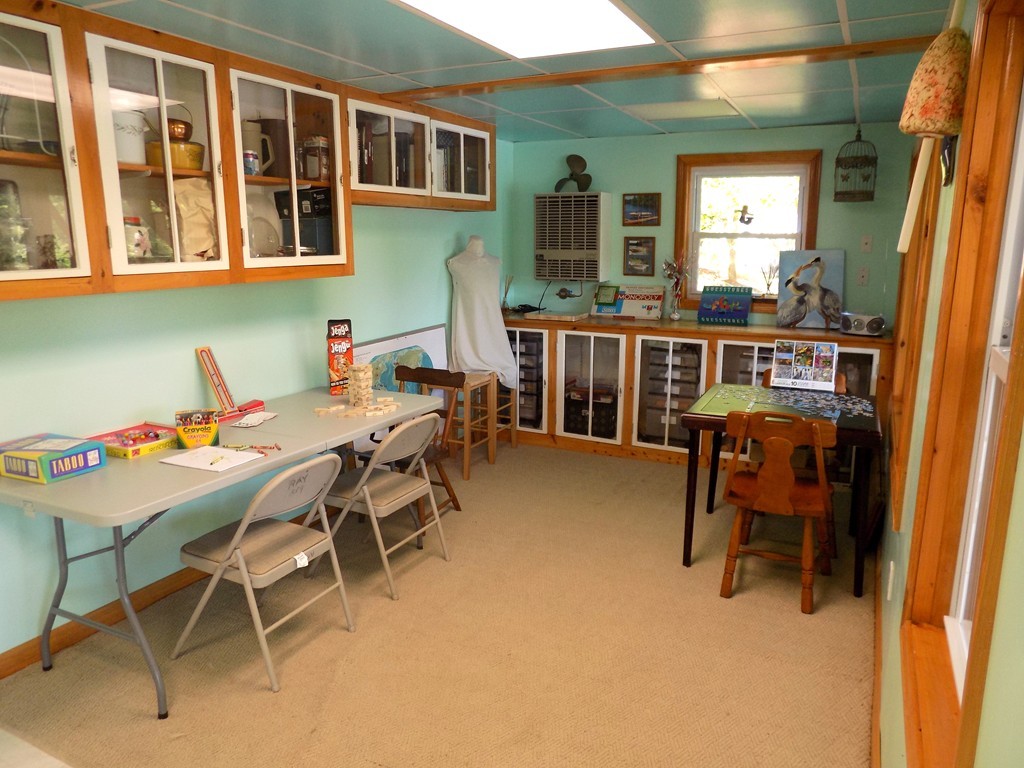 101 Sandy Beach Road Holland, MA 01521 - Photo 12 of 23 a dining room with furniture and window