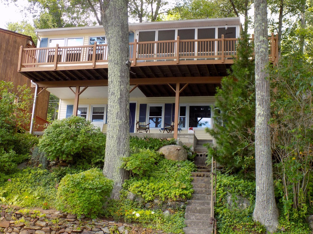 101 Sandy Beach Road Holland, MA 01521 - Photo 18 of 23 front view of a house with a garden