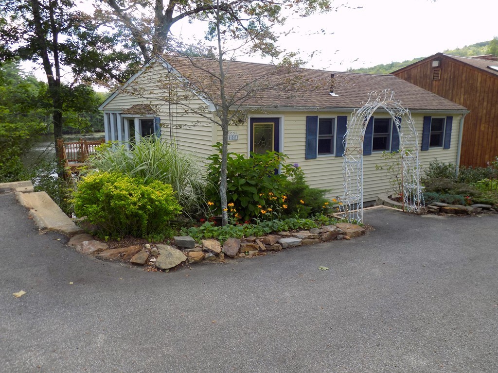 101 Sandy Beach Road Holland, MA 01521 - Photo 20 of 23 front view of a house with a small yard