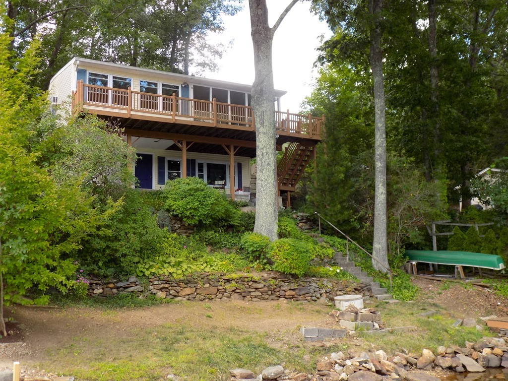 101 Sandy Beach Road Holland, MA 01521 - Photo 3 of 23 a view of a yard in front of house