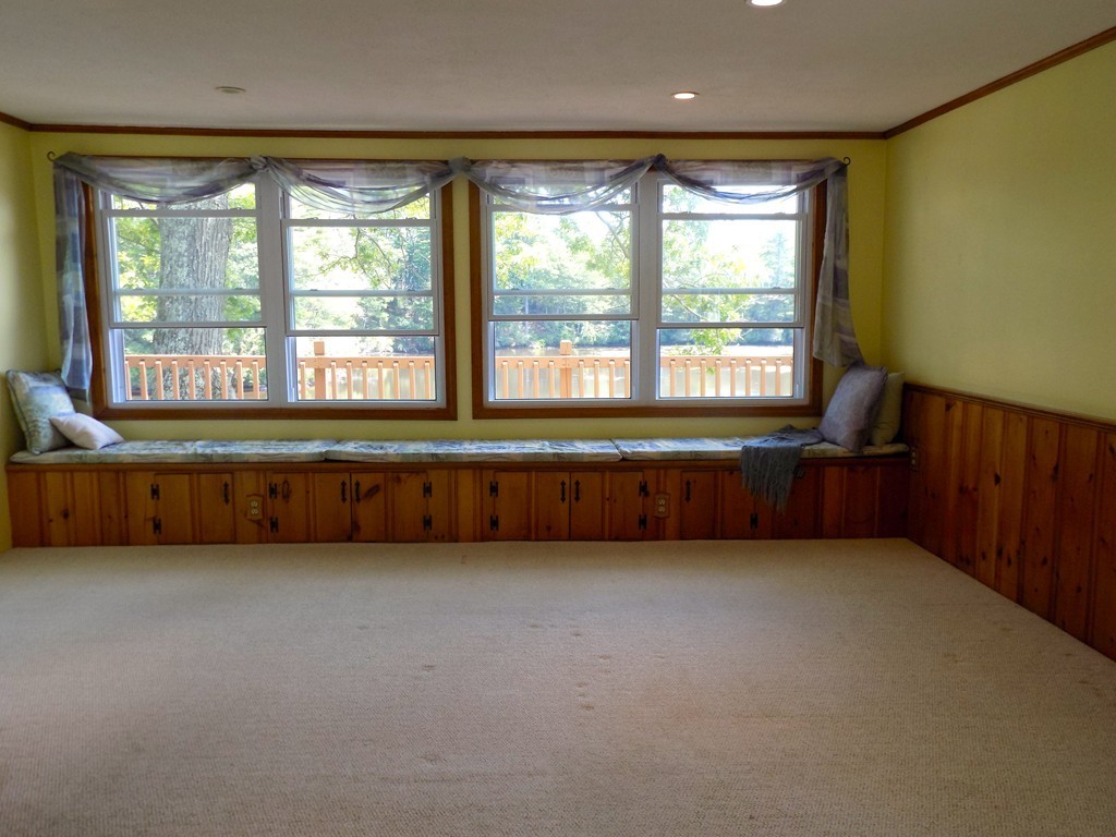 101 Sandy Beach Road Holland, MA 01521 - Photo 8 of 23 a room with a bed and a large window
