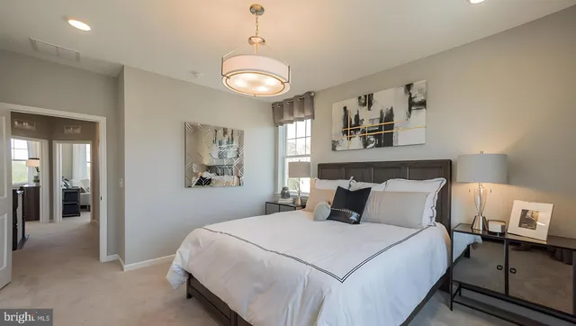 a bathroom with a shower sink and mirror
