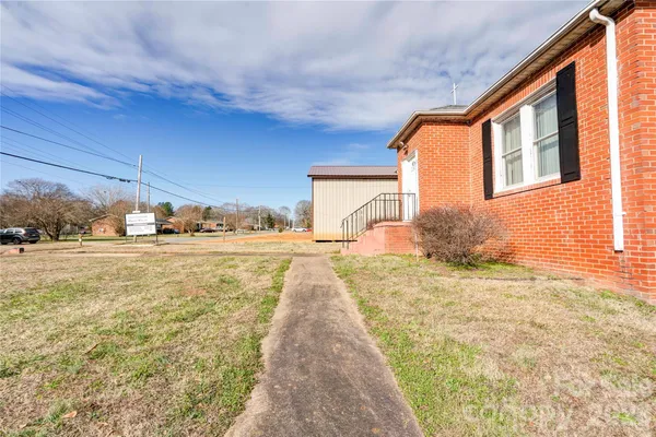 a view of an ocean with palm trees