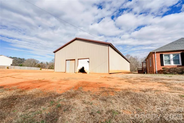 a view of empty room with wooden fence