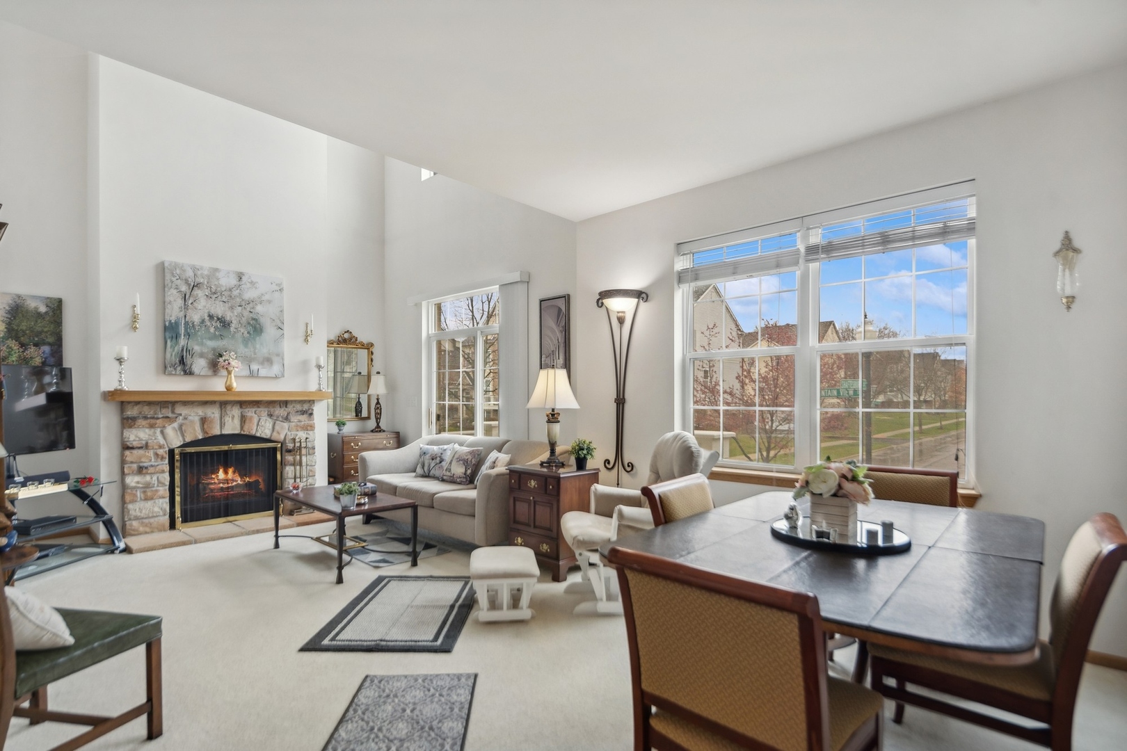 1116 Bartholdi Court Carol Stream, IL 60188 - Photo 2 of 21 a living room with furniture large window and a fireplace