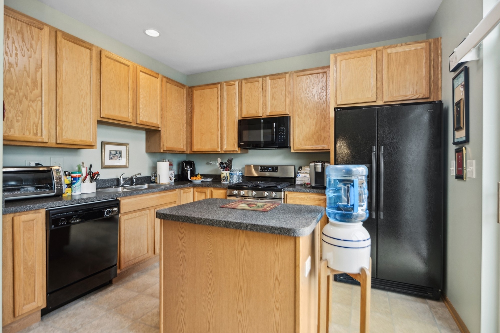 1116 Bartholdi Court Carol Stream, IL 60188 - Photo 6 of 21 a kitchen with stainless steel appliances granite countertop a refrigerator stove top oven a sink and dishwasher