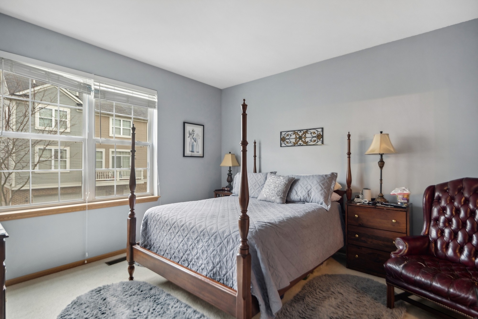 1116 Bartholdi Court Carol Stream, IL 60188 - Photo 9 of 21 a bedroom with a bed couch and a window