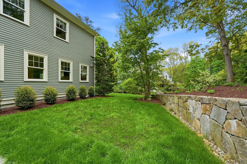 6 Flintlock Road Lexington, MA 02420 - Photo 39 of 39 a front view of a house with a yard