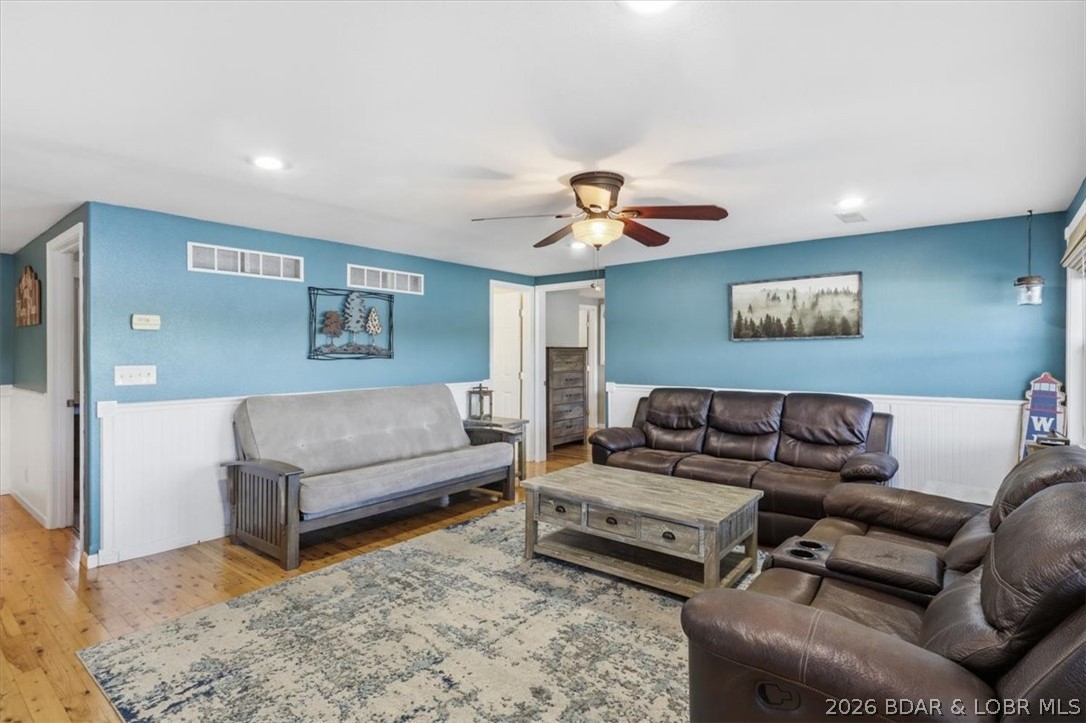 2202 Spring Cove Road Sunrise Beach, MO 65079 - Photo 4 of 57 The coastal blue walls, white waincotting and wood
