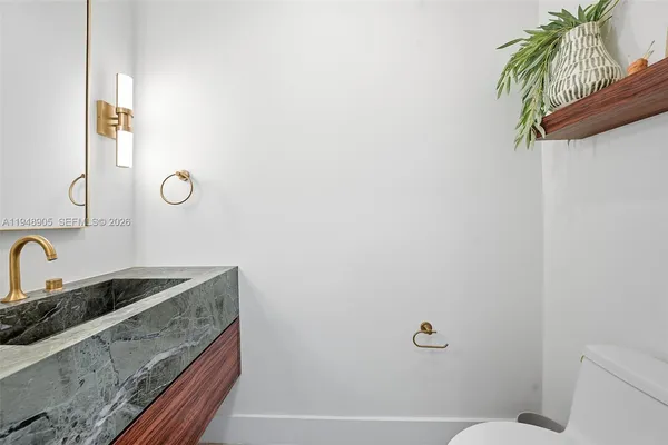 a bathroom with a sink a toilet and tub