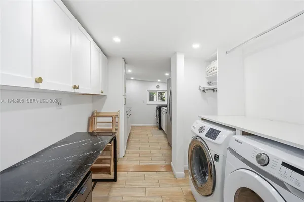 a view of hallway with washer and dryer